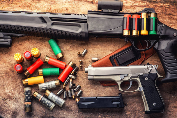 Weapons and military equipment. 9 mm pistol gun bullets and 12 gauge shotgun  - Photo, Image