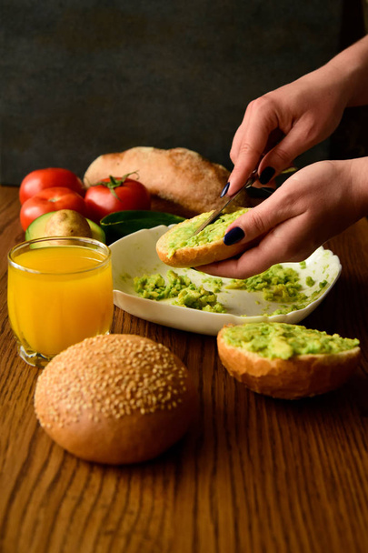 Making avocado toast on the home kitchen - Photo, Image