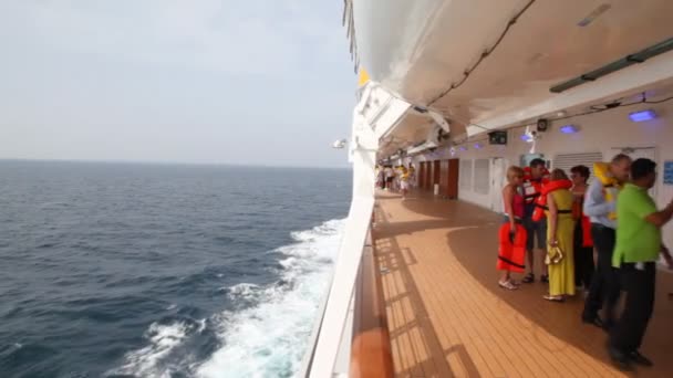 in life jackets on deck of cruise ship in Persian Gulf. - Filmati, video