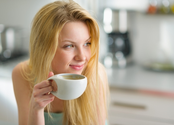 Portrait of happy young woman drinking coffee in the morning - Fotografie, Obrázek