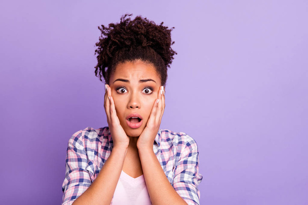 Close up photo disappointed frightened lady impressed astonished by unbelievable unexpected event have fear anxious confused open mouth top-knot dressed modern clothing isolated purple background - Foto, Imagen