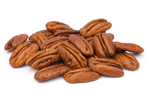 Pile Pecan nuts isolated on white background. Heap shelled Pecans nut closeup. Tasty raw organic food and healthy snack - Photo, Image