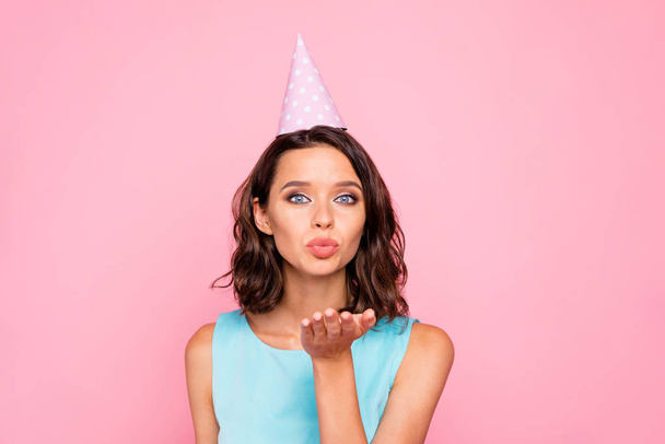 Close up photo amazing beautiful she her lady attractive pretty appearance birthday cap head send air kiss all guests friends relatives wear shiny colorful blue dress isolated pink bright background - Fotoğraf, Görsel