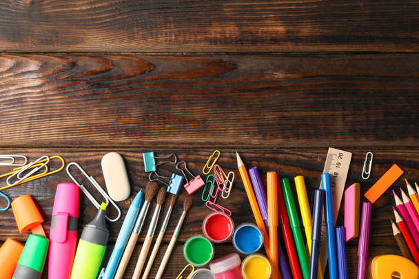 Flat lay composition with school supplies on wooden background,  - Φωτογραφία, εικόνα