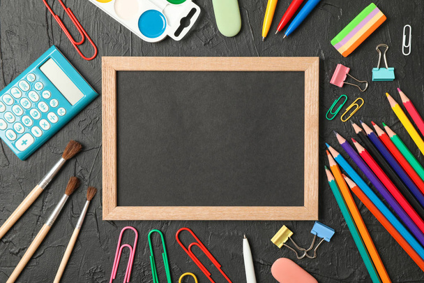 Composition with school supplies on black background, space for  - Фото, изображение