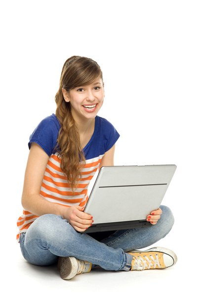 Young woman using laptop - Foto, afbeelding