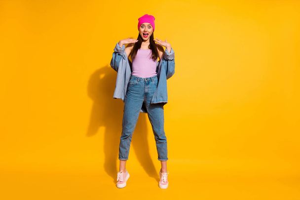 Full length body size view photo of charming lady astonished impressed incredible novelty scream she shout feel rejoice enjoy wear sneakers fashionable clothing isolated yellow background - 写真・画像