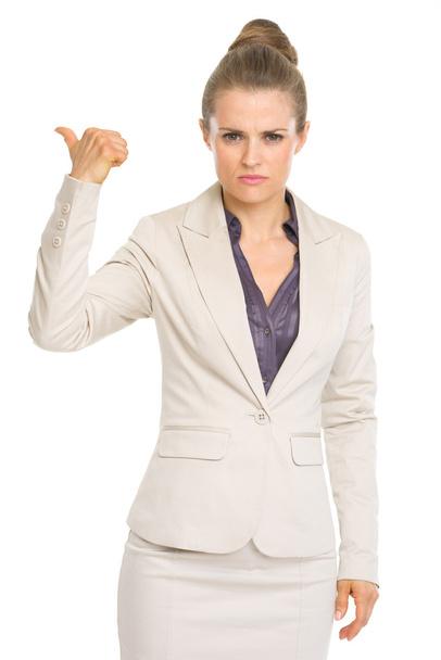 Serious business woman showing get out gesture - Foto, imagen
