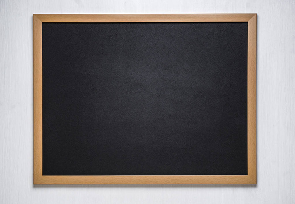 chalk board on a wooden background - Foto, imagen