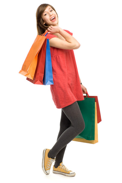 Young woman with shopping bags - 写真・画像