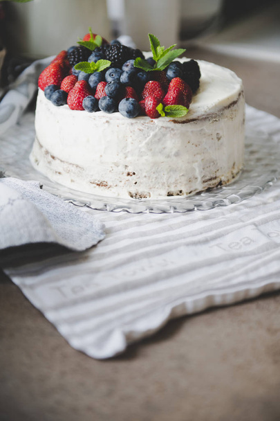 beautiful white cream cheese cake with different summer berries  - Fotoğraf, Görsel