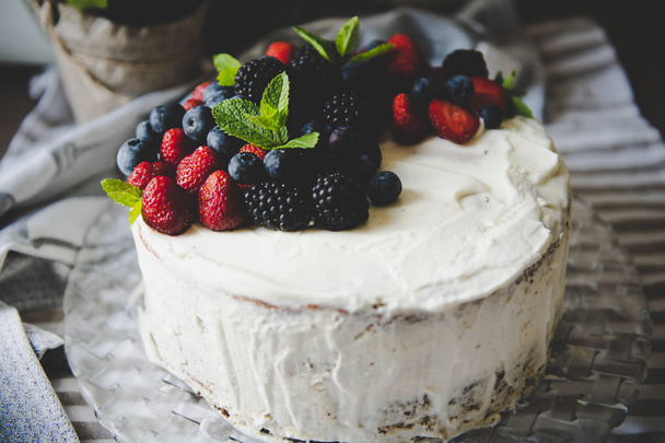 beautiful white cream cheese cake with different summer berries  - 写真・画像