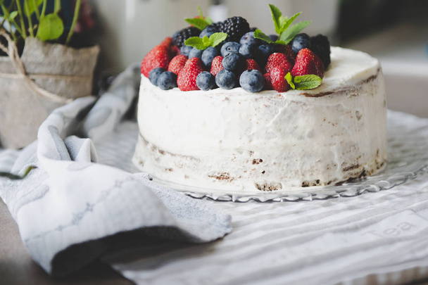 beautiful white cream cheese cake with different summer berries  - Фото, зображення