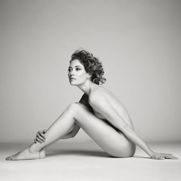 Nude woman with elegant hairstyle on gray background - Fotografie, Obrázek