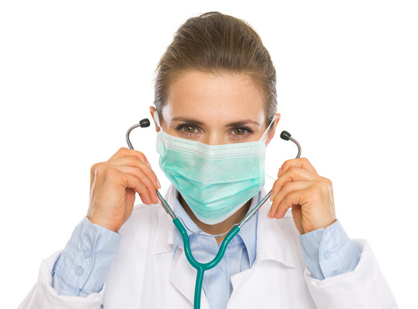 Doctor woman in mask using stethoscope - Foto, imagen
