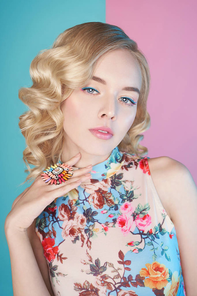 Blonde woman with color makup on colorful background - Fotó, kép