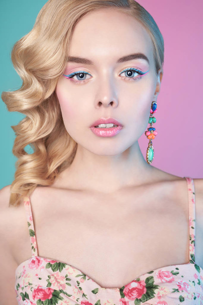 Blonde woman with color makup on colorful background - Foto, immagini