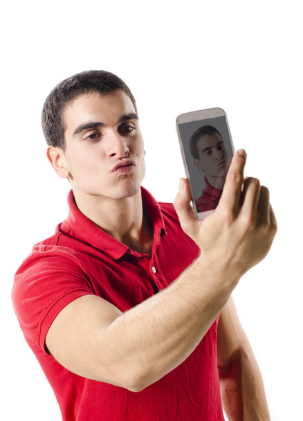 Isolated young man making selfie portrait - Φωτογραφία, εικόνα
