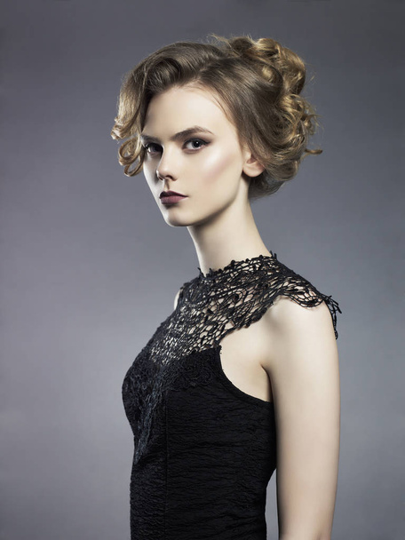 Beautiful young lady on black background - Fotografie, Obrázek
