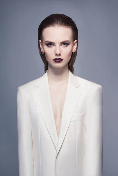 Elegant woman in white jacket - Фото, зображення