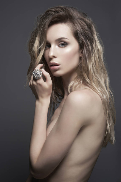 Young beautiful blonde with silver jewelry - Fotoğraf, Görsel