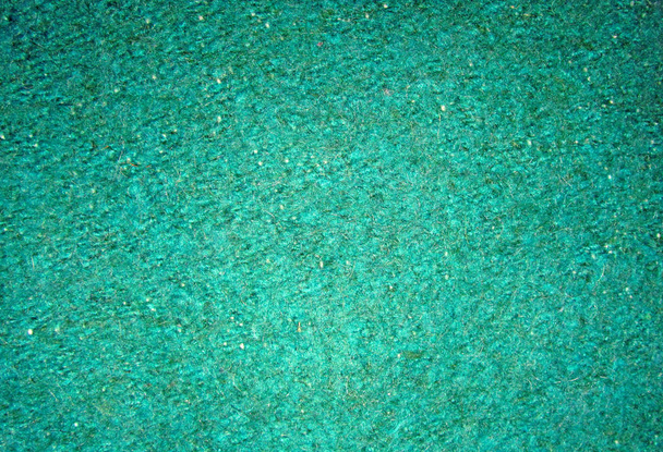 Η υφή της τραχιά επιφάνεια του πράσινου υφάσματος κοντινό - Φωτογραφία, εικόνα