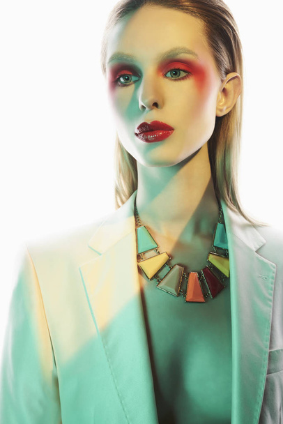 Sexy lady in colorful neacklace and white jacket - Fotoğraf, Görsel