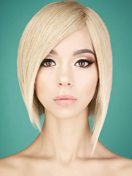 Lovely asian woman with blonde short hair  - Fotó, kép