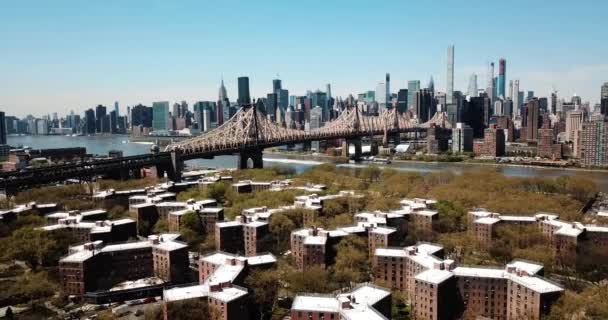 Aerial of Queensborough bridge and downtown Manhattan and Queens rooftops - Footage, Video