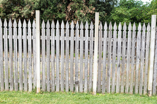 Wooden picket fence in the meadow - Photo, Image