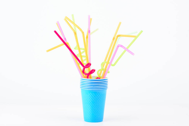 Colored plastic tubes in blue glass - Photo, image