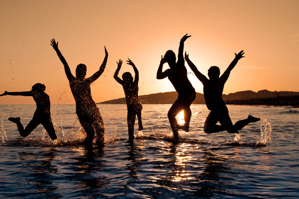 Silhouette of family jumping - Foto, Imagen