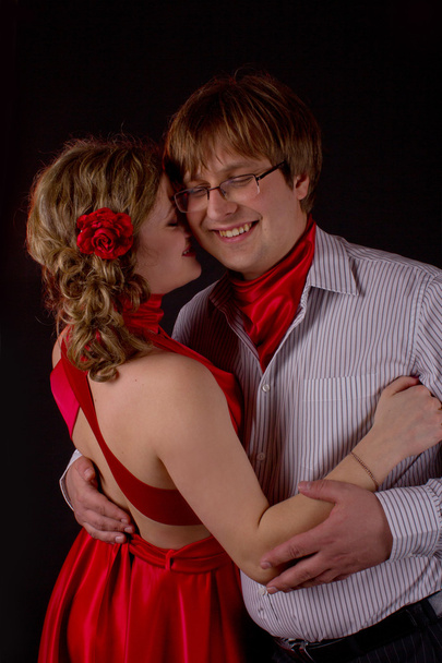 young couple in red dancing tango - 写真・画像