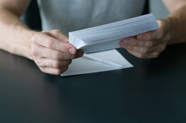 invitation letter man stack white paper sheets - 写真・画像