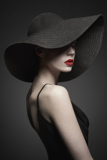 portrait of young lady with black hat and evening dress - Foto, Imagem