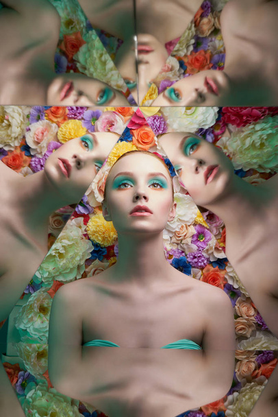 young beautiful woman with bright colorfull makeup on flower bac - Foto, afbeelding