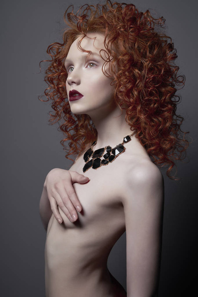Beautiful nude woman with black jewelry. Fashion portrait - Zdjęcie, obraz