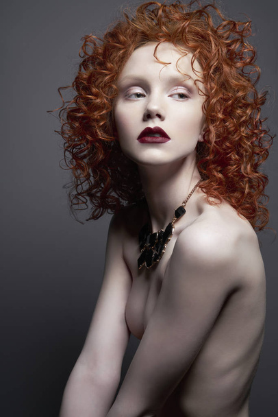 Beautiful nude woman with black jewelry. Fashion portrait - Photo, image