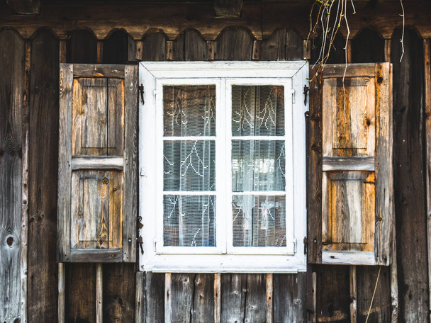 Old wooden windows in a rural hut - Фото, зображення