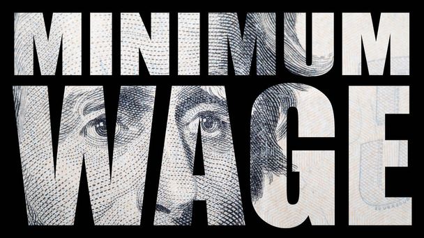Minimum wage inscription with dollar banknote texture inside - Photo, Image