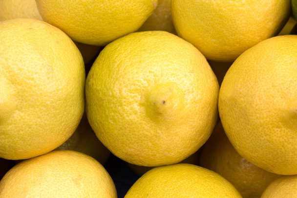 lemons at grocery store or market, closeup - Fotografie, Obrázek
