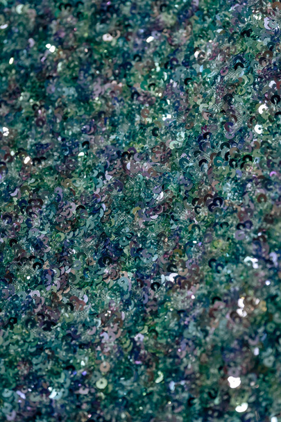 Fabric with blue sequins. The texture of the shiny material. Decorative fabric trimmed with blue sequins. - Photo, Image