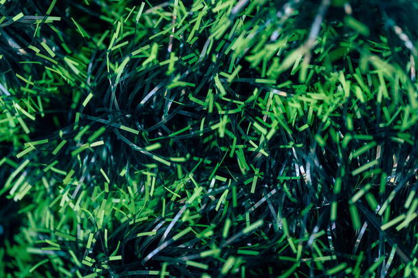 Decorative artificial turf. Short green grass. Artificial flowers and plants. - Photo, Image