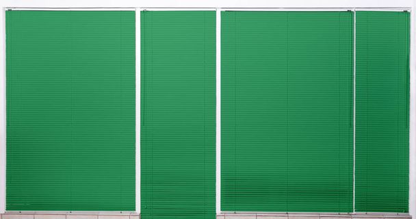 Modern window with closed stylish green blinds - Photo, Image