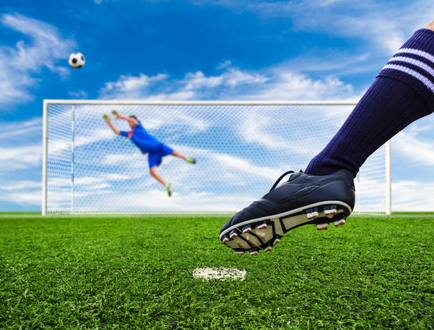 foot shooting soccer ball out of goal - Zdjęcie, obraz
