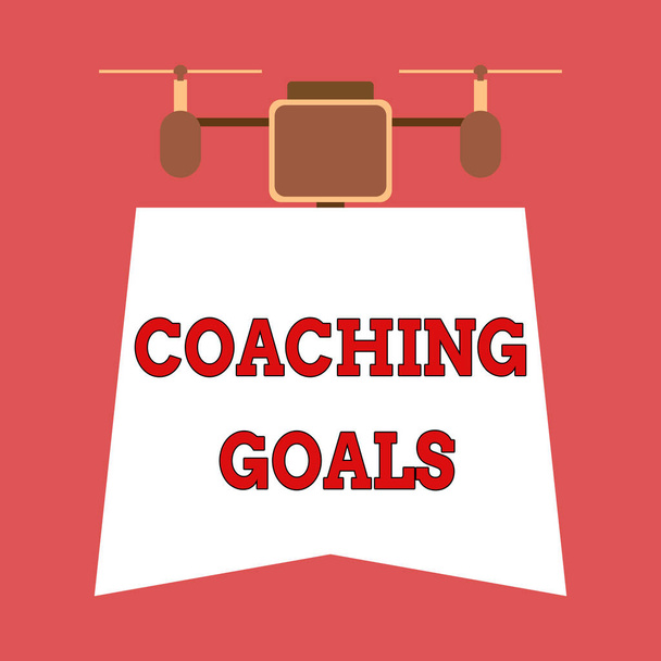 Writing note showing Coaching Goals. Business photo showcasing Empowers individuals Encourages them to take responsibility Drone holding downwards banner. Geometrical abstract background design. - Photo, Image