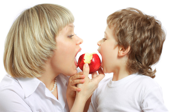 Woman and boy eating apple - Zdjęcie, obraz