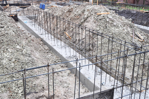 Reinforcement in a strip house wall foundation. House foundation construction. - Photo, Image