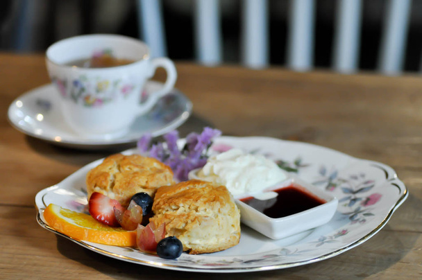 scone or scone with fruit ,whipping cream  - Foto, imagen