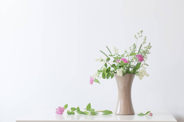 summer flowers in vase on table  - Фото, зображення